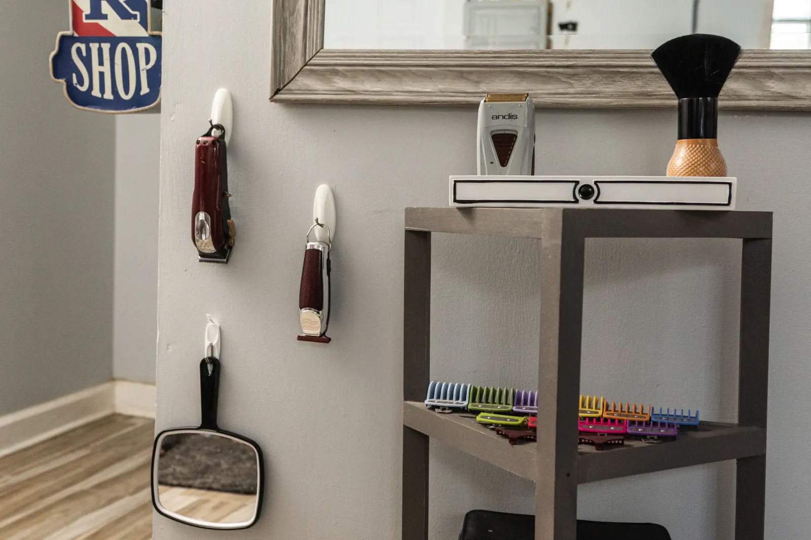 The Chop Shop grooming station with clippers, mirror and colorful guards