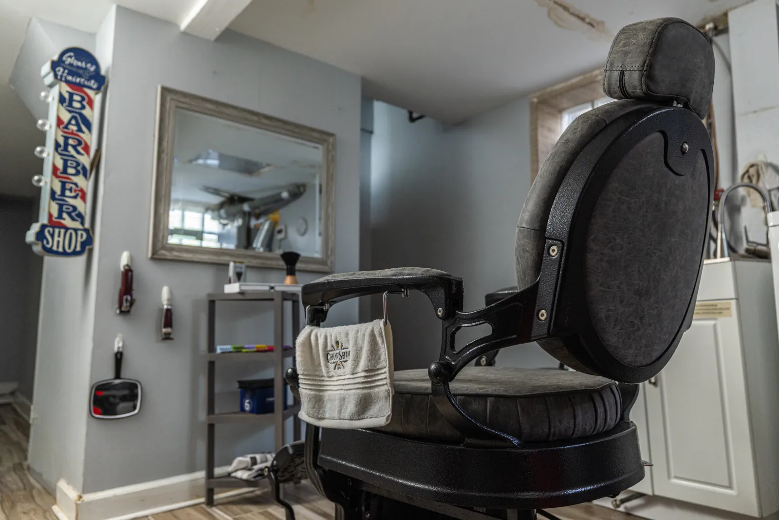 Private barber chair and grooming station inside The Chop Shop