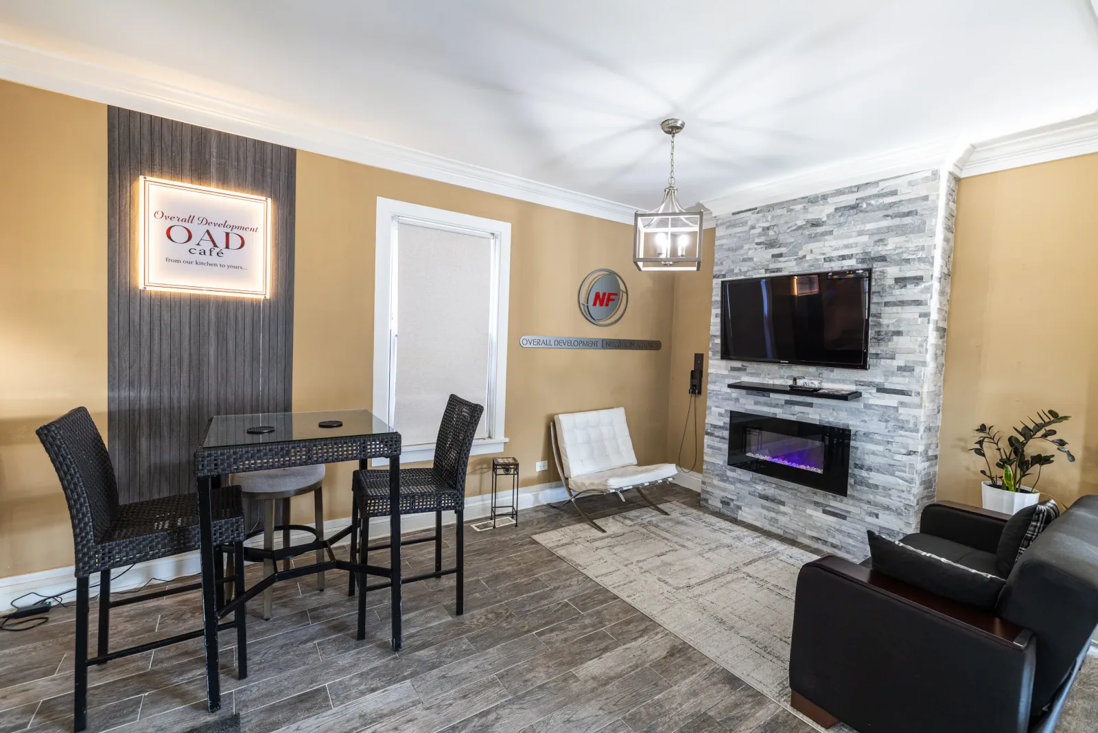 OAD Cafe seating beside the fireplace inside Overall Development